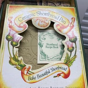 Ceramic shortbread pan with recipe book.